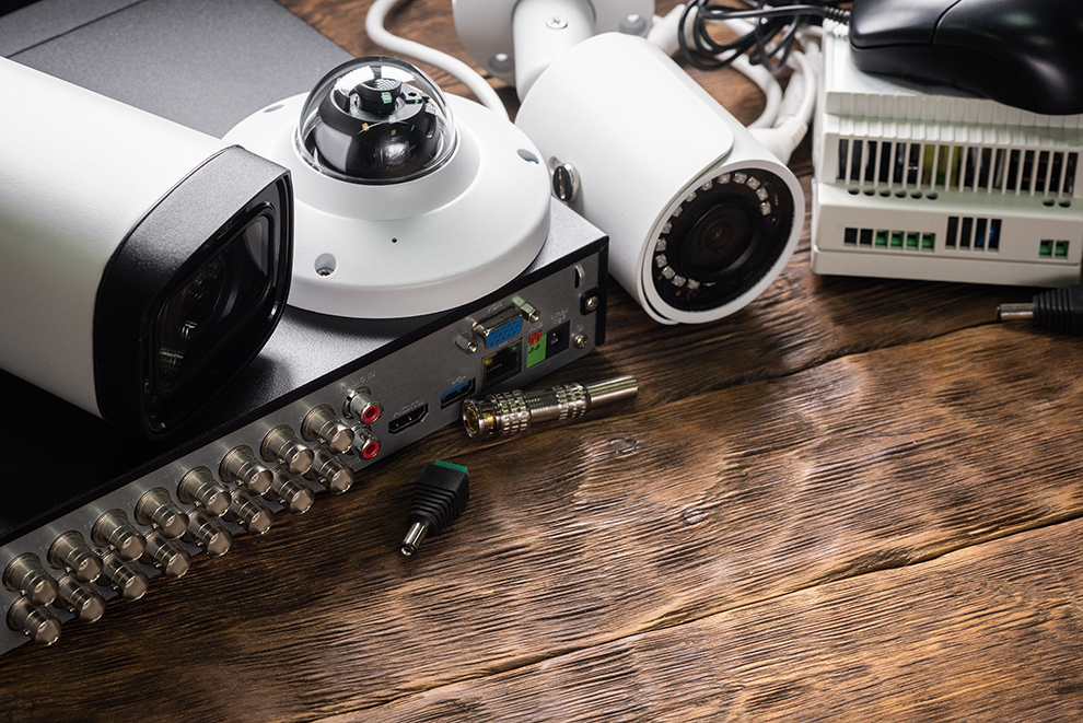 Security cameras and units on a wooden table