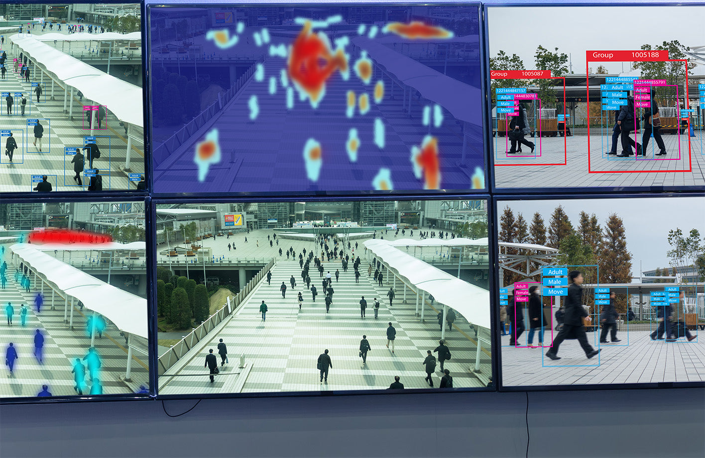 A wall of monitors using A.I. to track people in a public setting