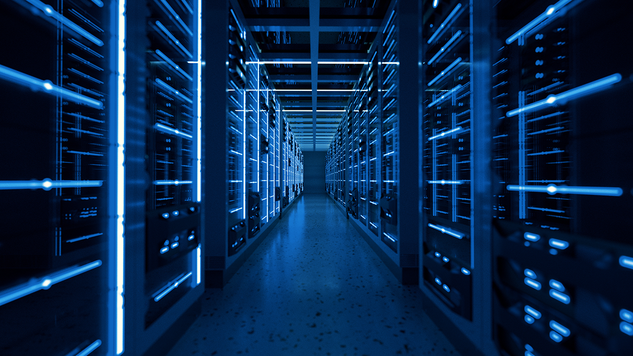 A blue-lit hallway lines with computer servers