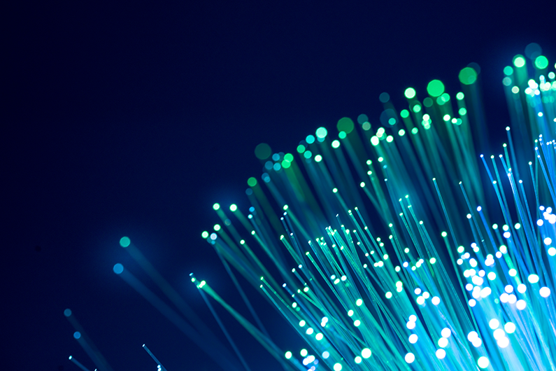 A lit up bundle of fiber optic cable ends